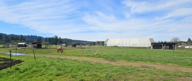 Pastures with the covered arena behind